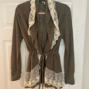 Beautiful brown sweater with cream color embroidered lace trim.